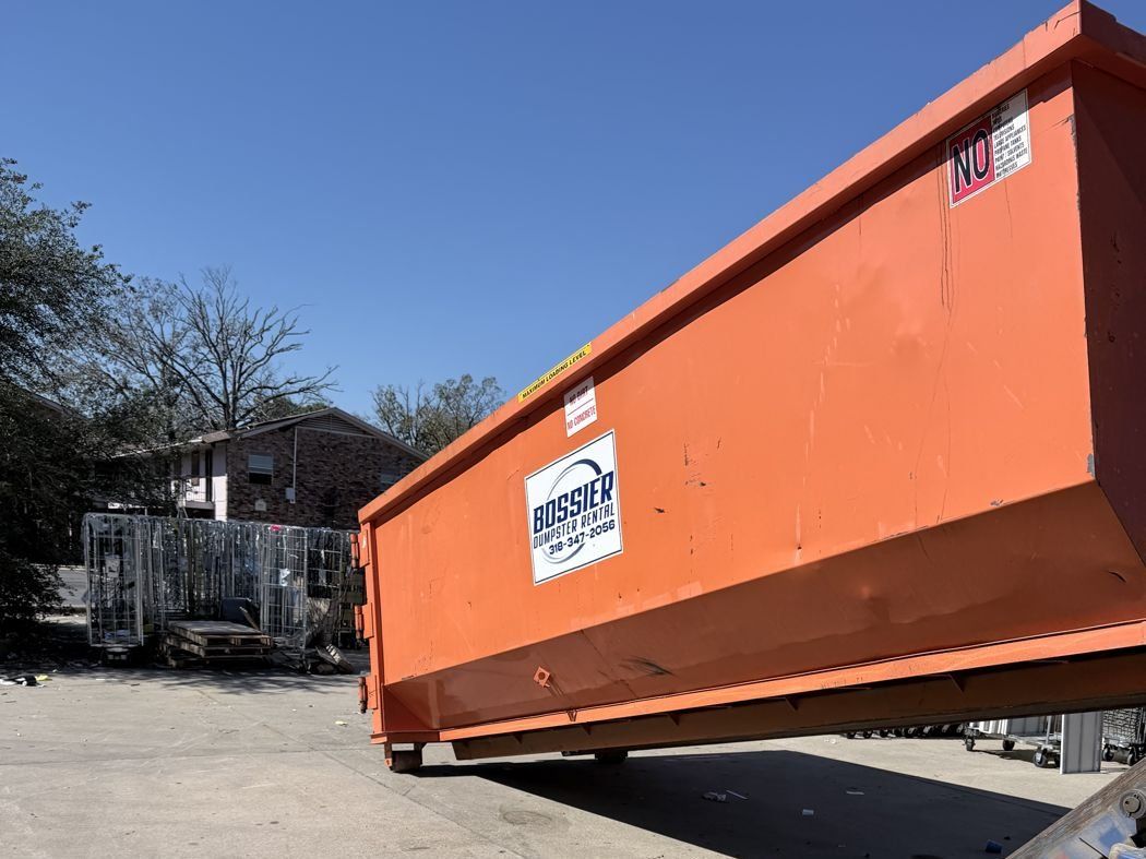 Orange Bossier Dumpster Rental 30-yard container loaded and ready to set